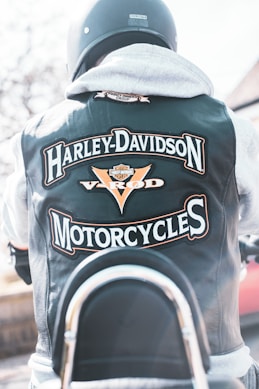 the back of a man wearing a harley davidson motorcycle jacket