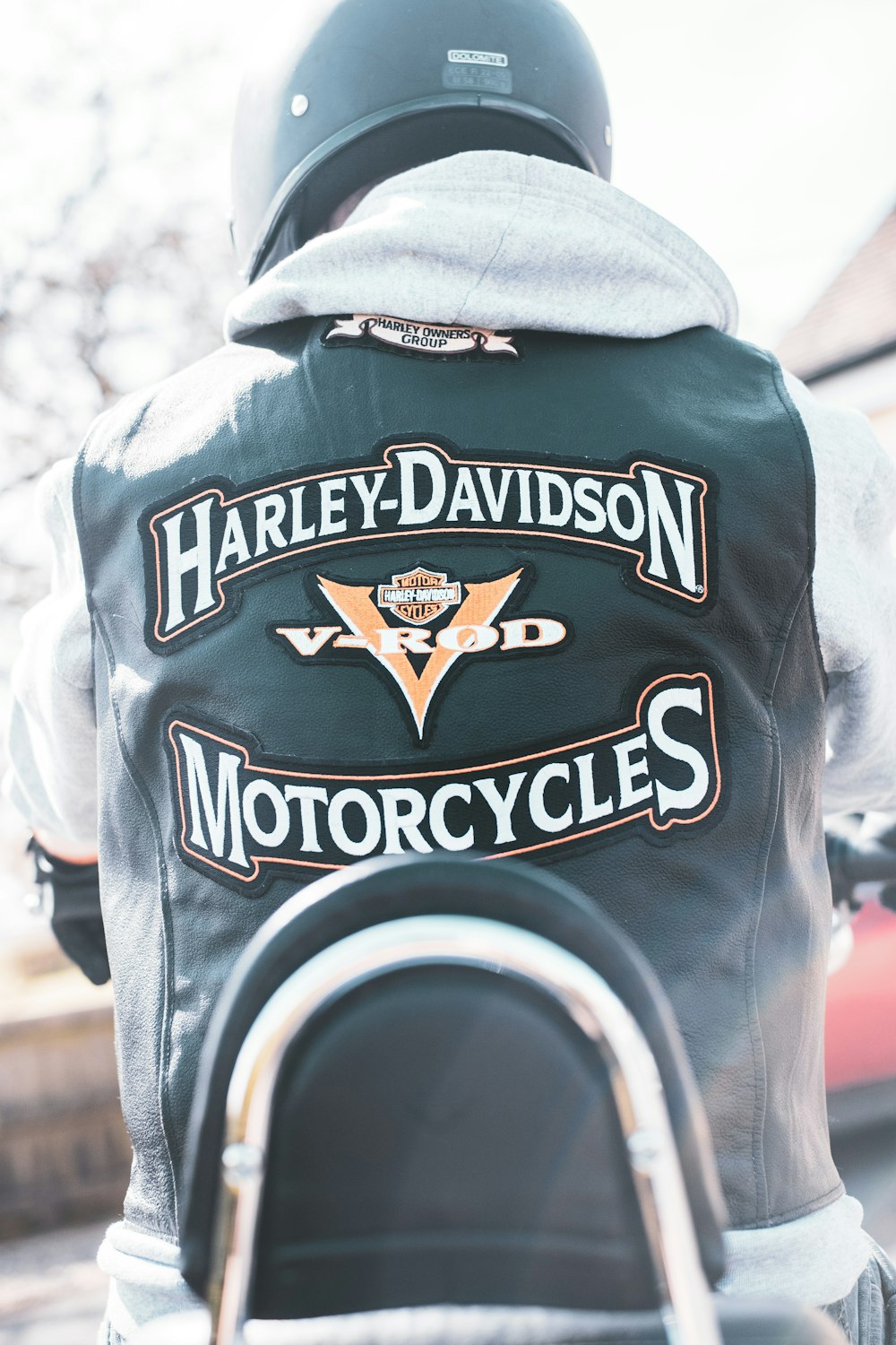 the back of a man wearing a harley davidson motorcycle jacket