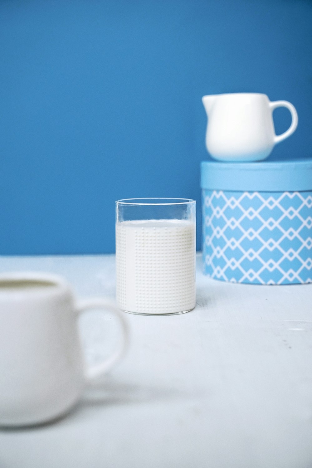 white and green ceramic mug