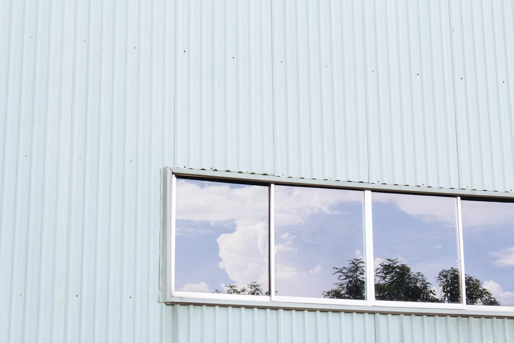 white wooden framed glass window