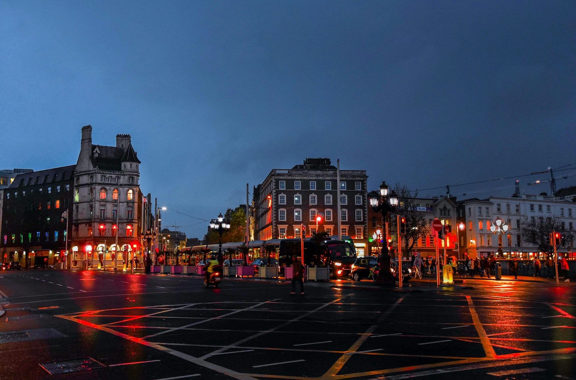 people walking on street during night time