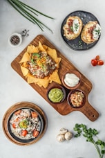 brown wooden chopping board with vegetable salad