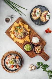 brown wooden chopping board with vegetable salad