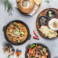 cooked food on black round plate