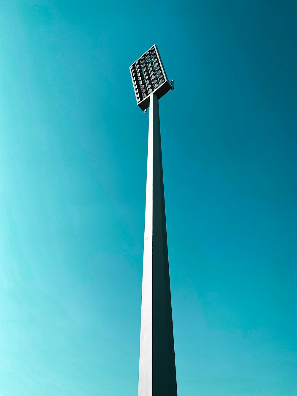 white and black street light under blue sky during daytime