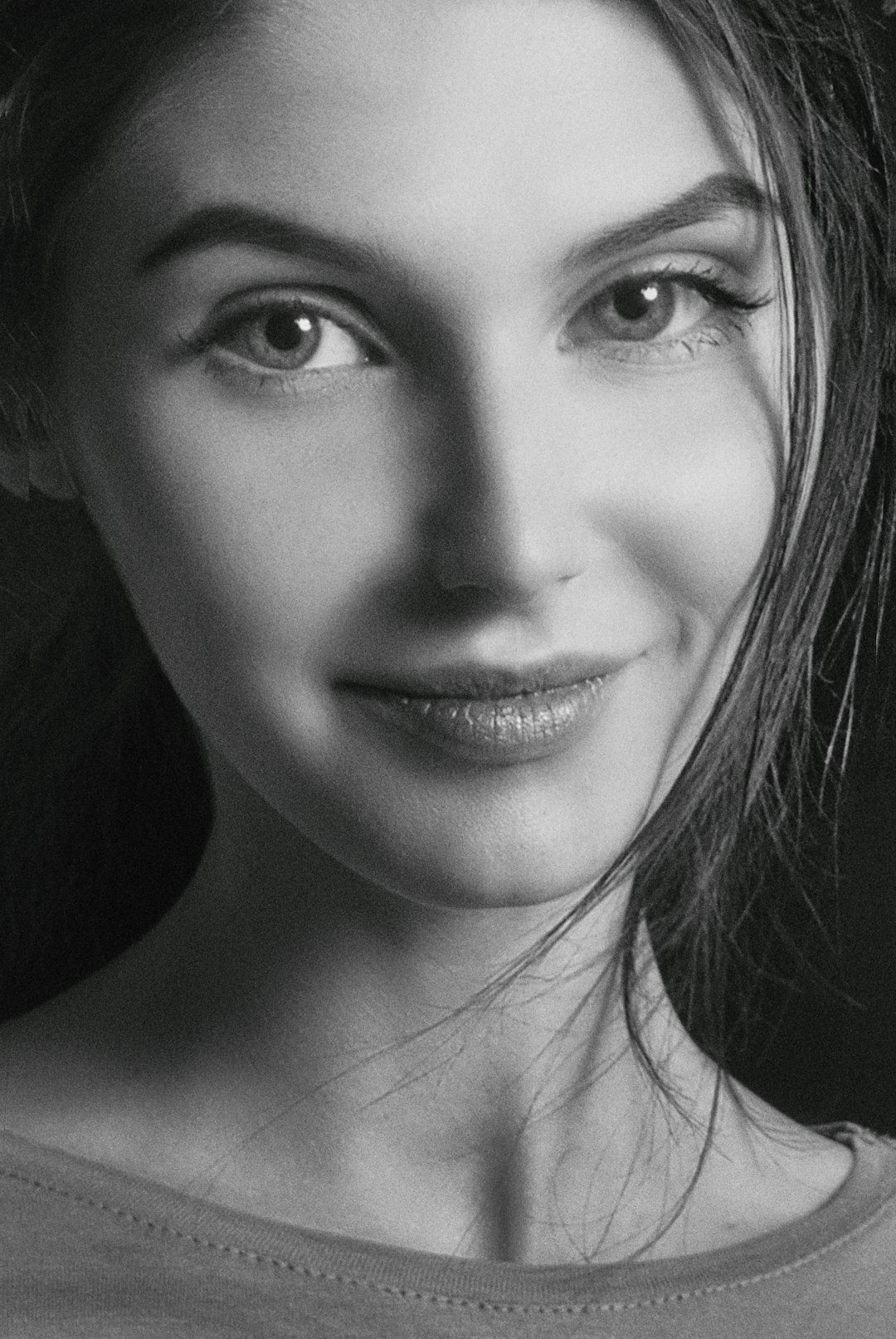 grayscale photo of womans face