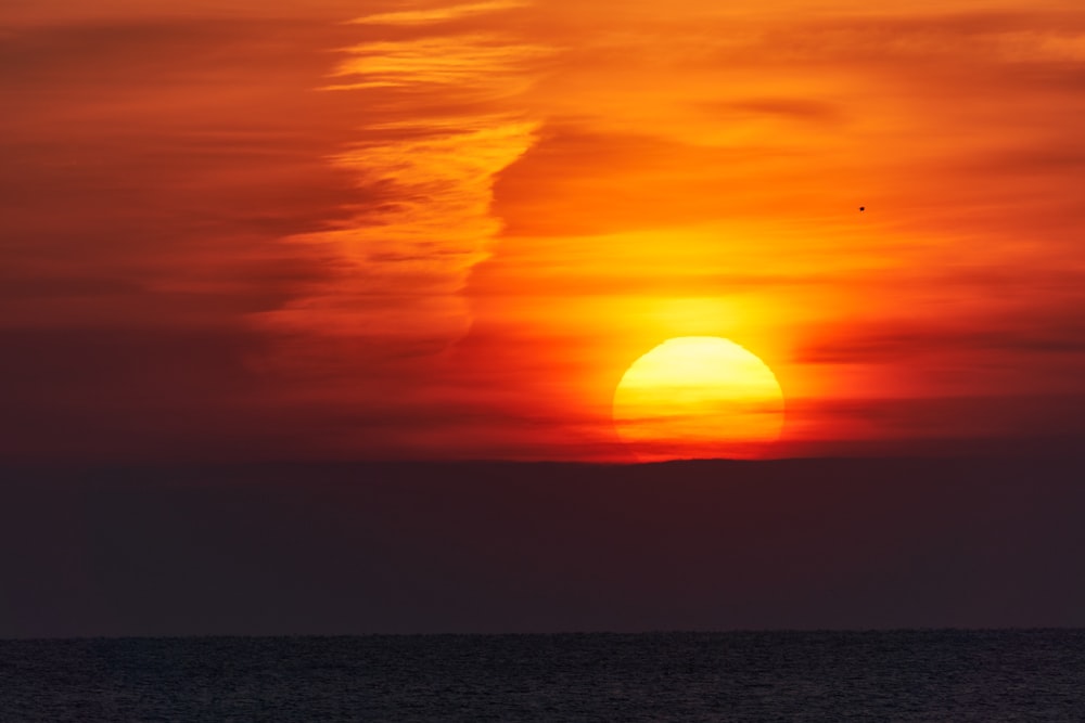 body of water during sunset