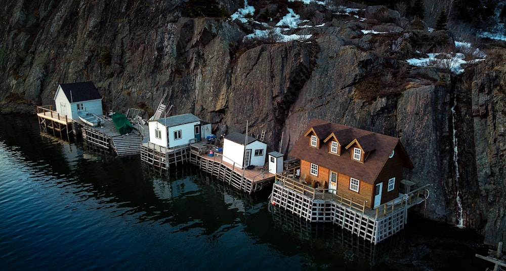 houses beside body of water during daytime