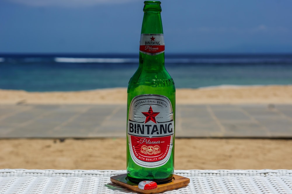 heineken bottle on brown wooden table