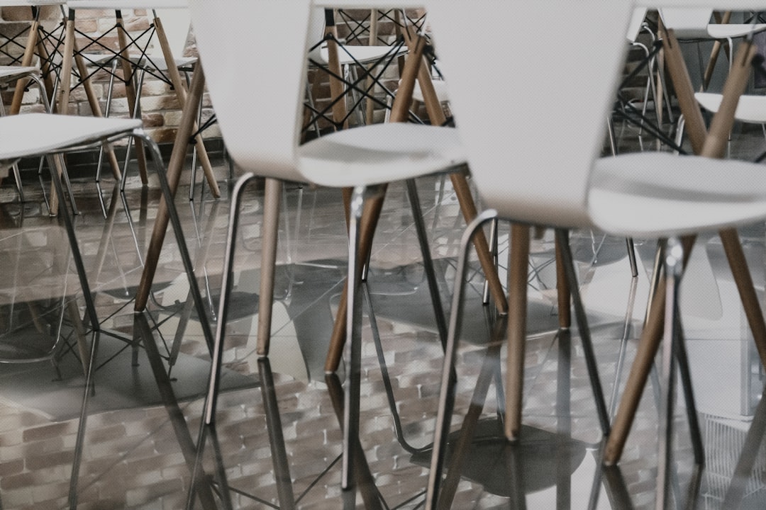 white chair beside brown table