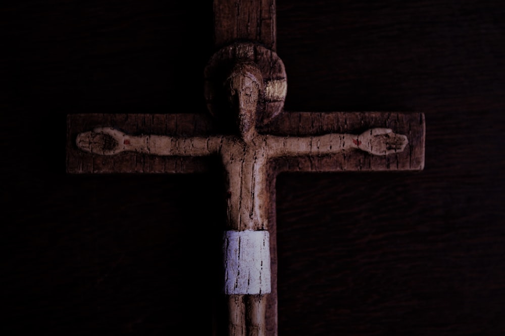 brown wooden cross with white cross