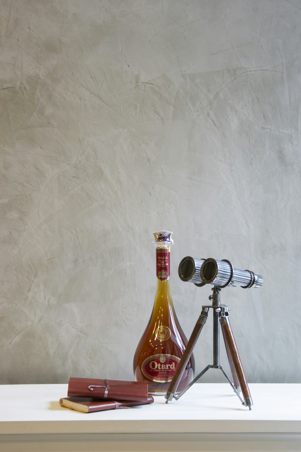 brown and silver bottle on brown wooden table