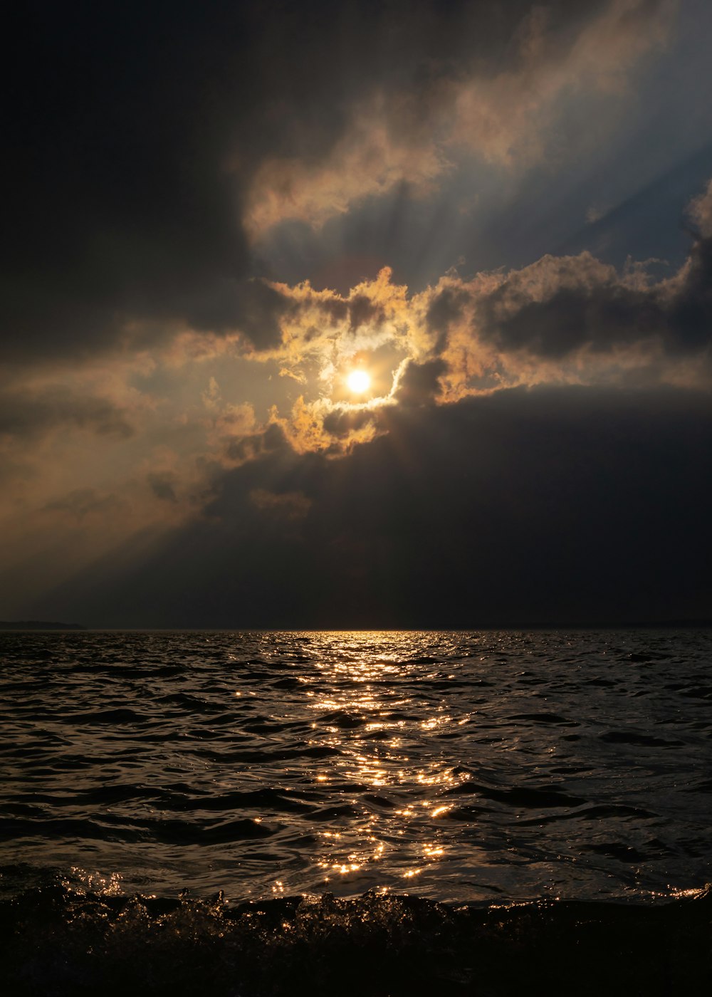 body of water under cloudy sky during daytime