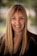 smiling woman in black blazer