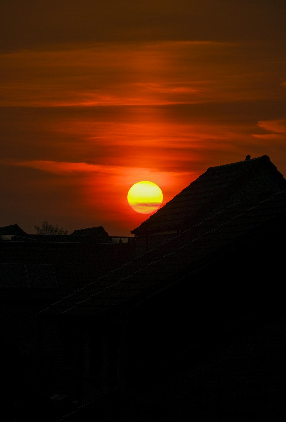 silhouette of house during sunset