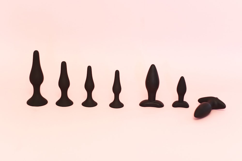 A variety of black butt plugs.