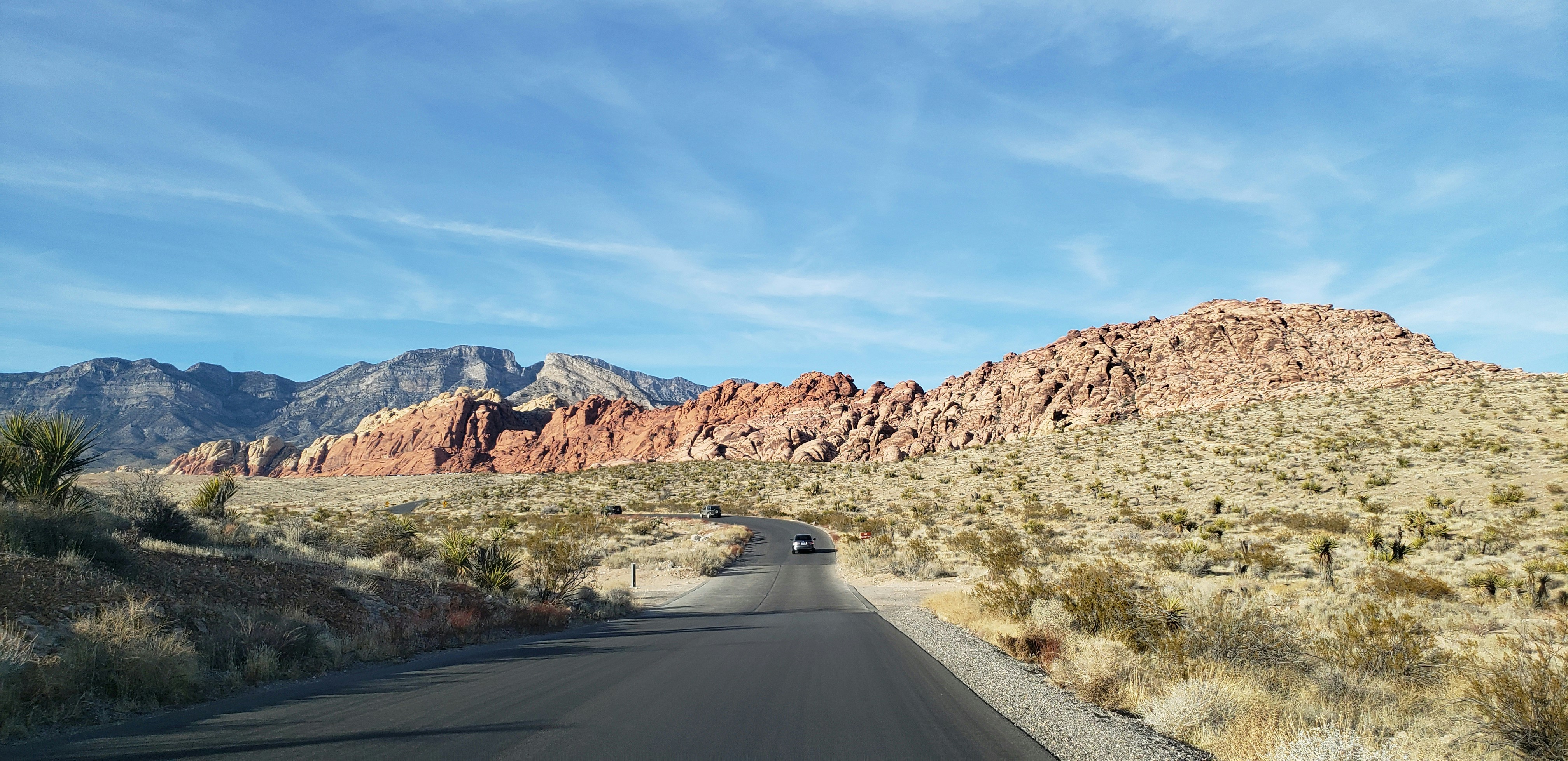 gray asphalt road between brown mountains during daytime, 