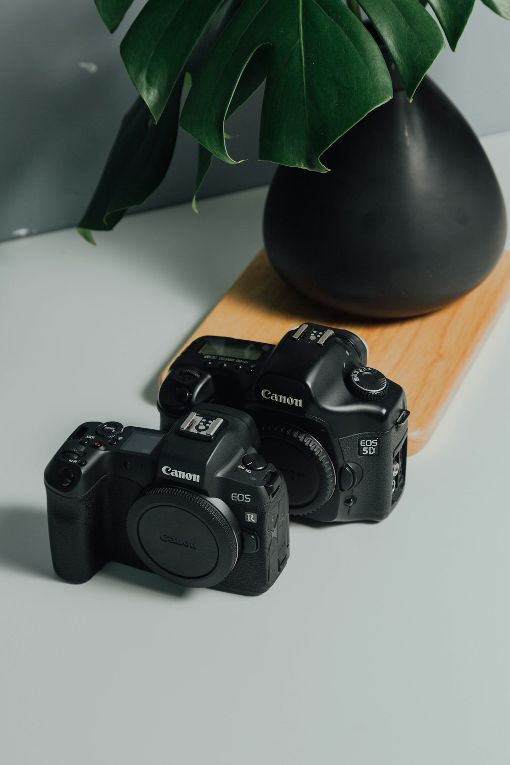 black nikon dslr camera on brown wooden table