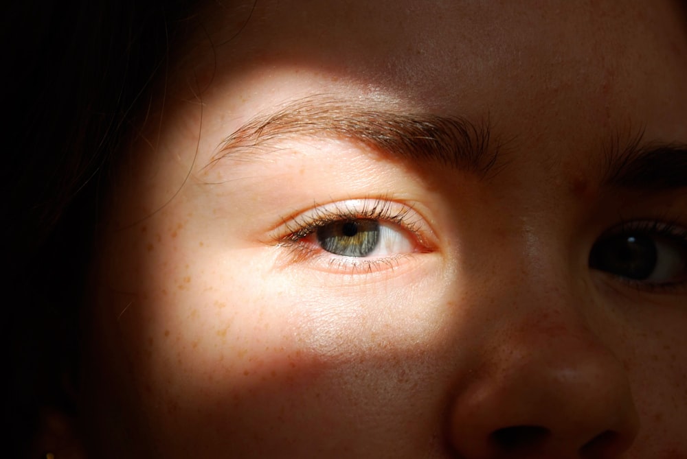 persons eye in close up photography