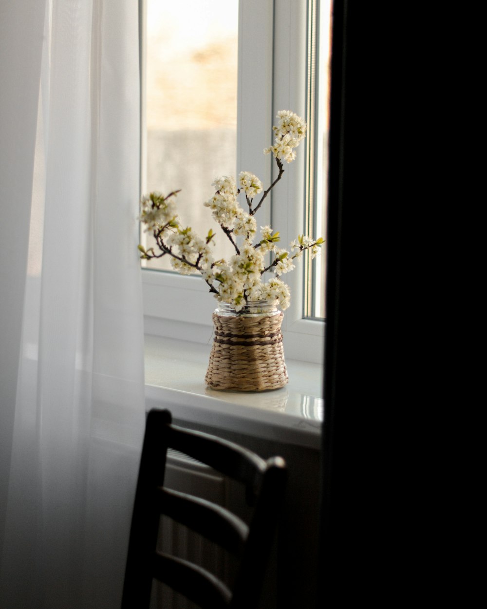 white flowers in brown woven basket