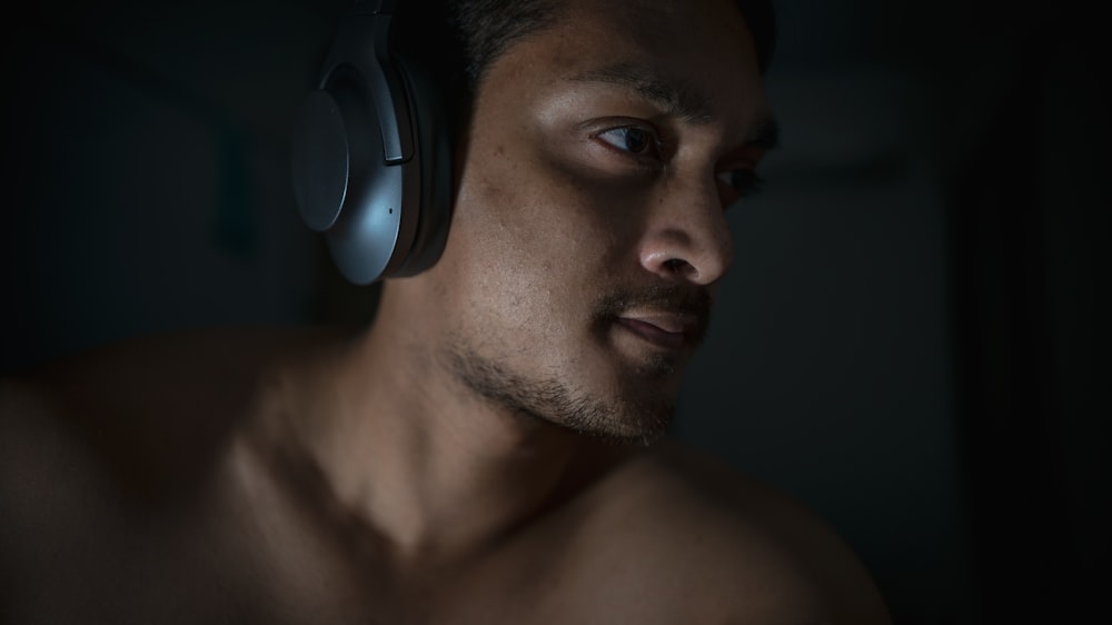 man wearing gray and black headphones