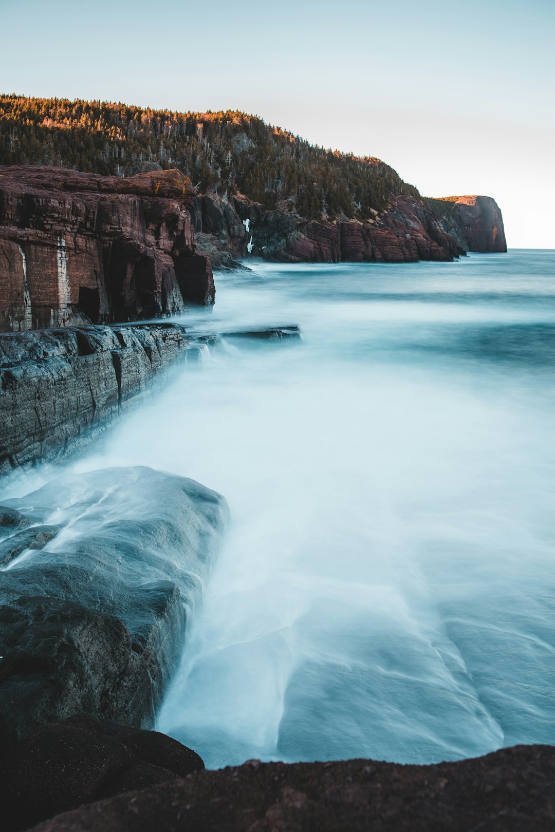 white boat on water falls