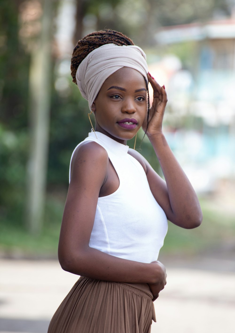 woman in white tank top and white knit cap