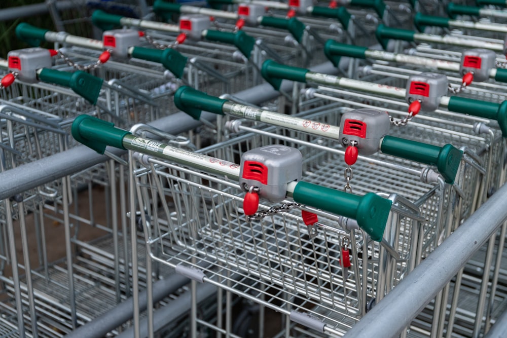 stainless steel shopping carts on gray metal rack