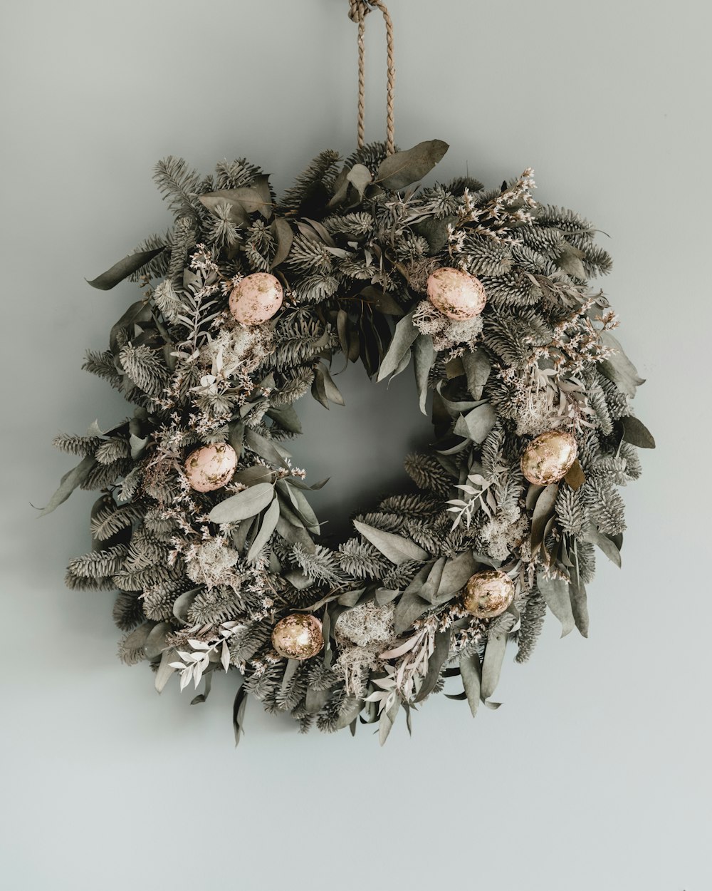 brown and white pine cone wreath