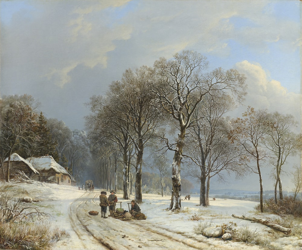 brown bare trees on snow covered ground under white clouds and blue sky during daytime