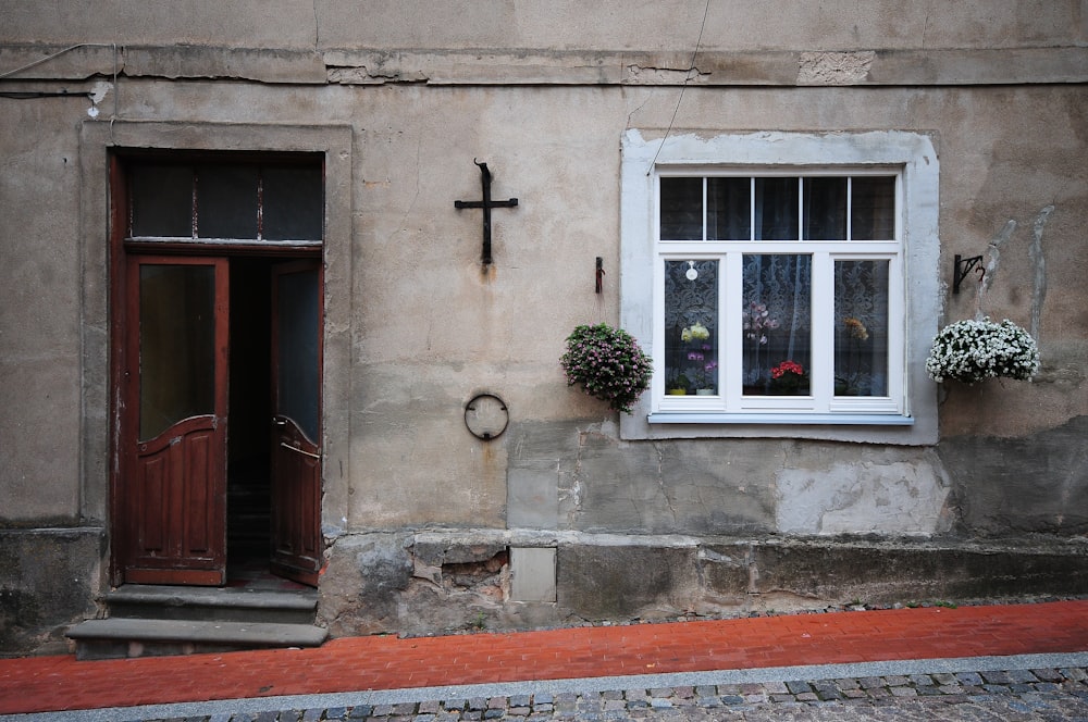 brown wooden door with white window frame