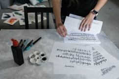 person holding white printer paper