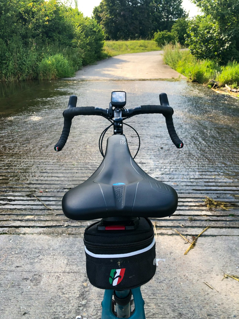 black bicycle on wooden dock