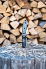 black and silver knife on brown and gray rocks