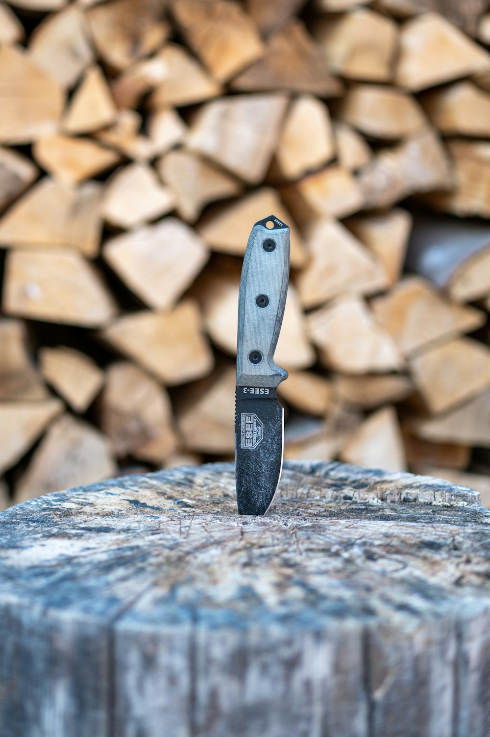 black and silver knife on brown and gray rocks