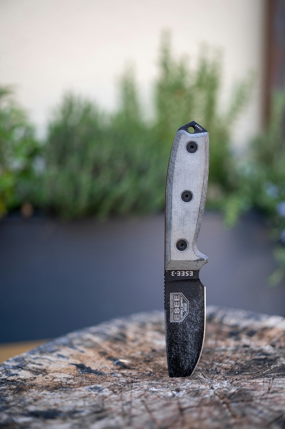 black and silver pocket knife on brown wooden table