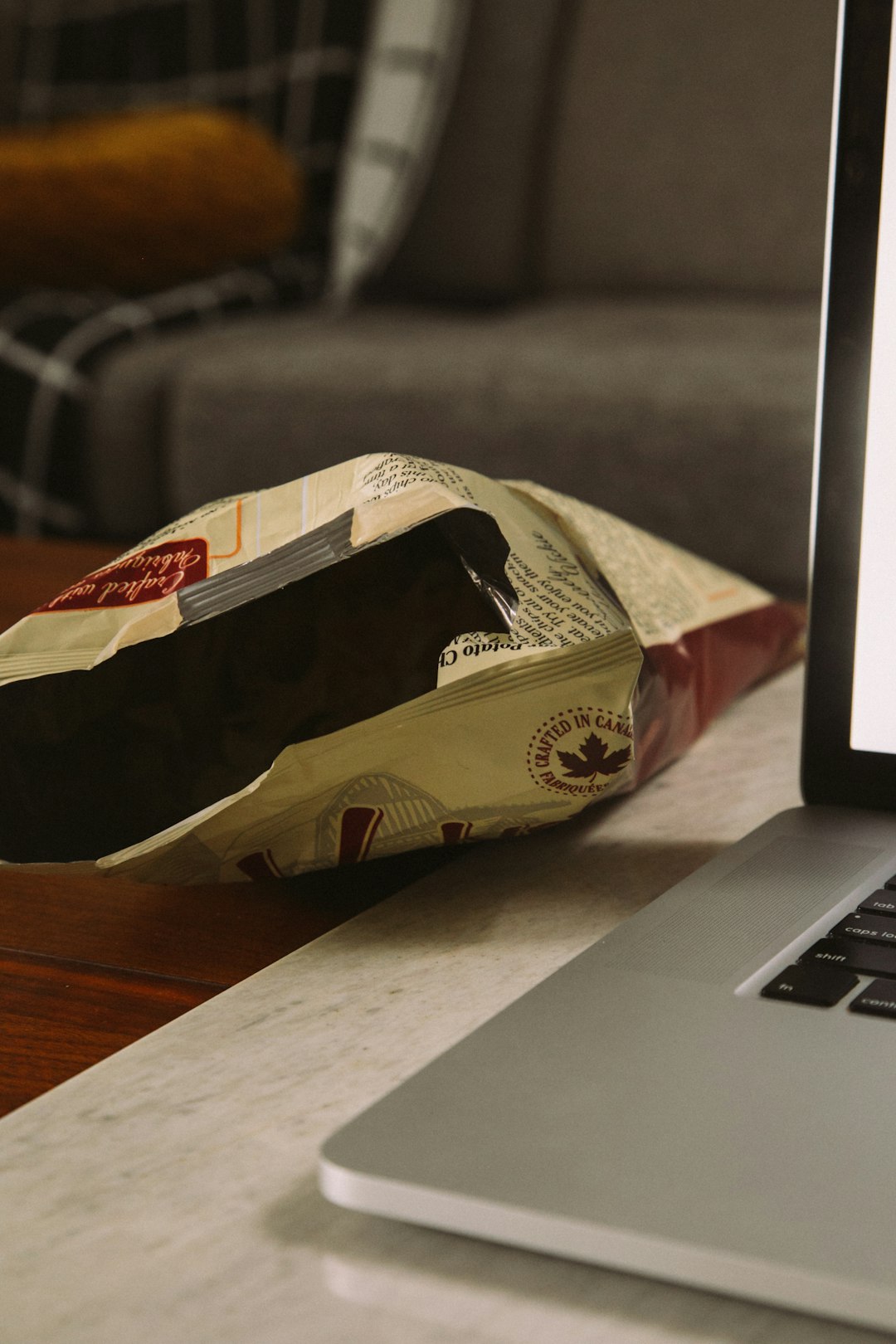 brown and red carton box on macbook pro