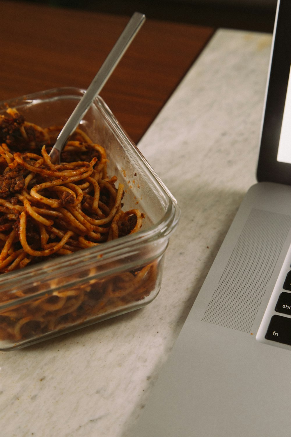 brown chili on clear plastic container