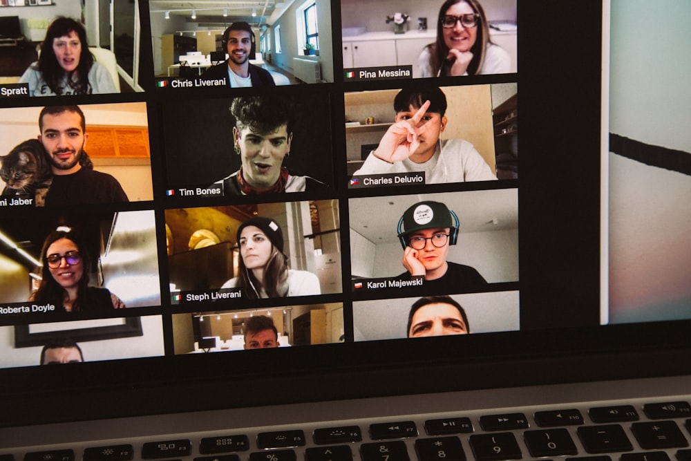 macbook pro displaying woman in black shirt