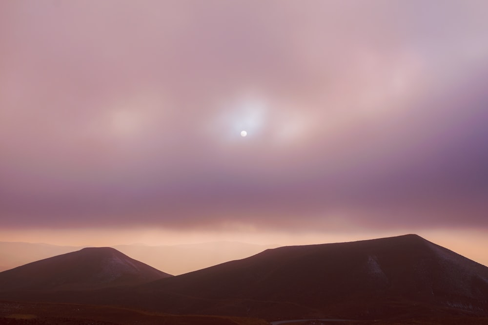 silhouette of mountains during sunset