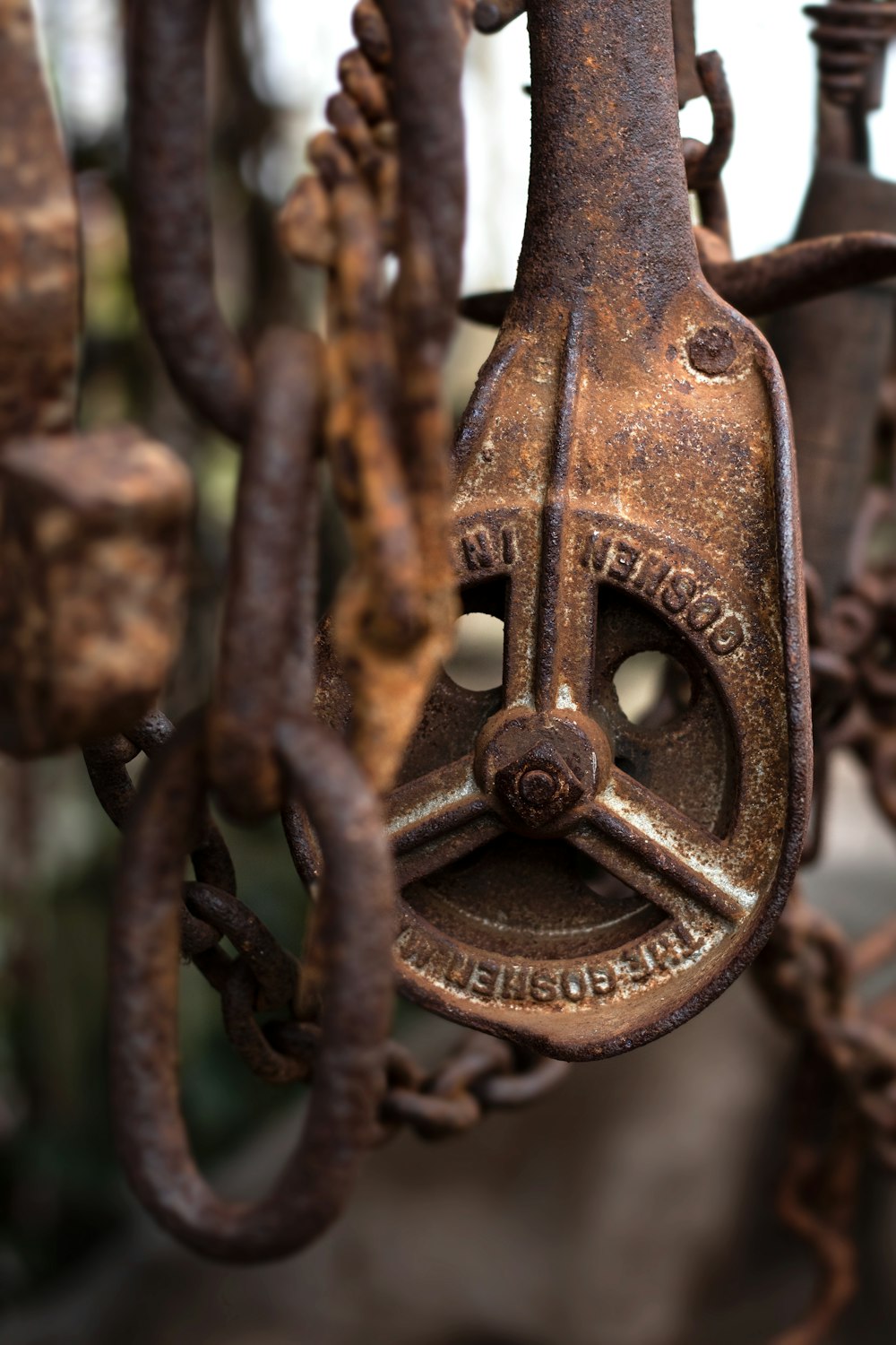 brown metal padlock on black metal fence