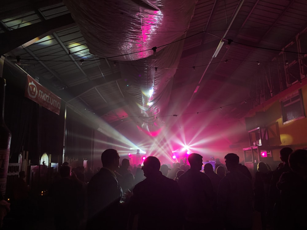 silhouette of people standing on stage