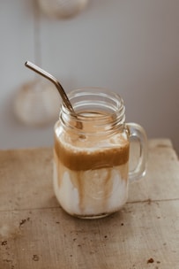 clear glass jar with brown liquid