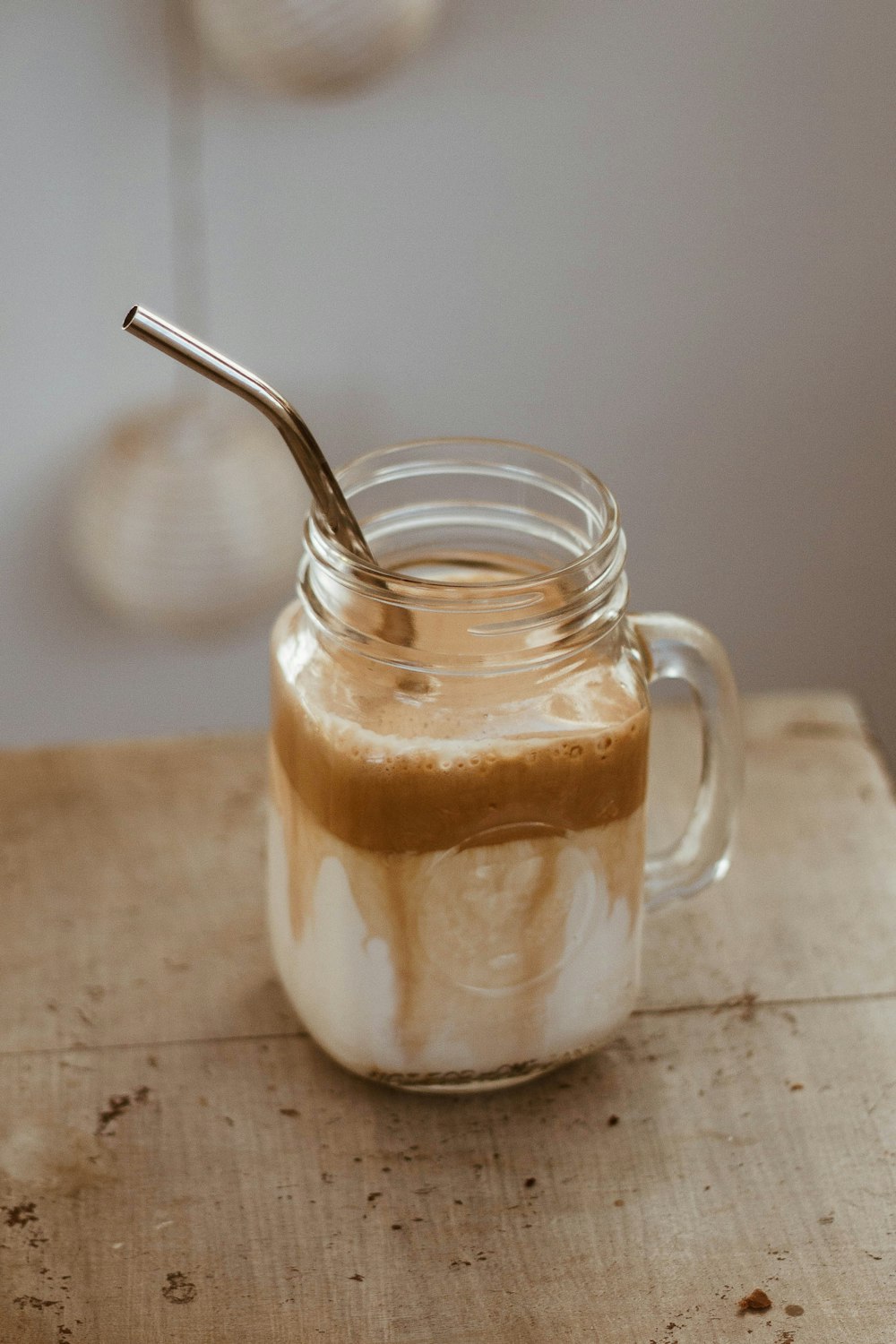 clear glass jar with brown liquid