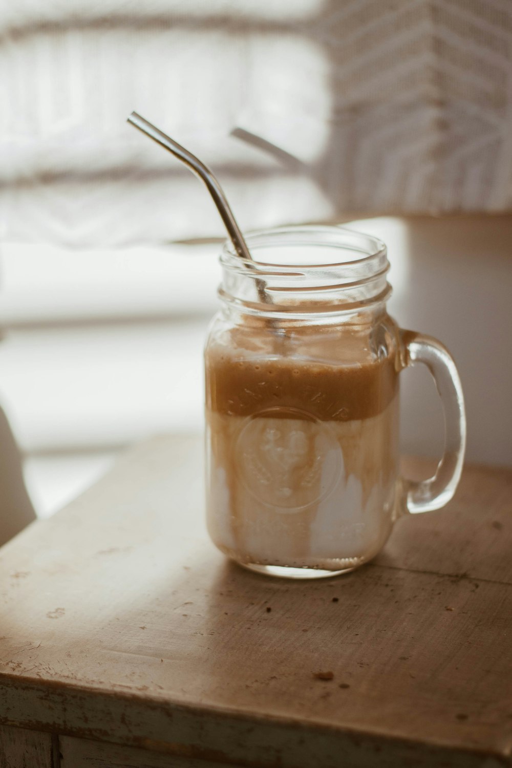 clear glass jar with stainless steel spoon