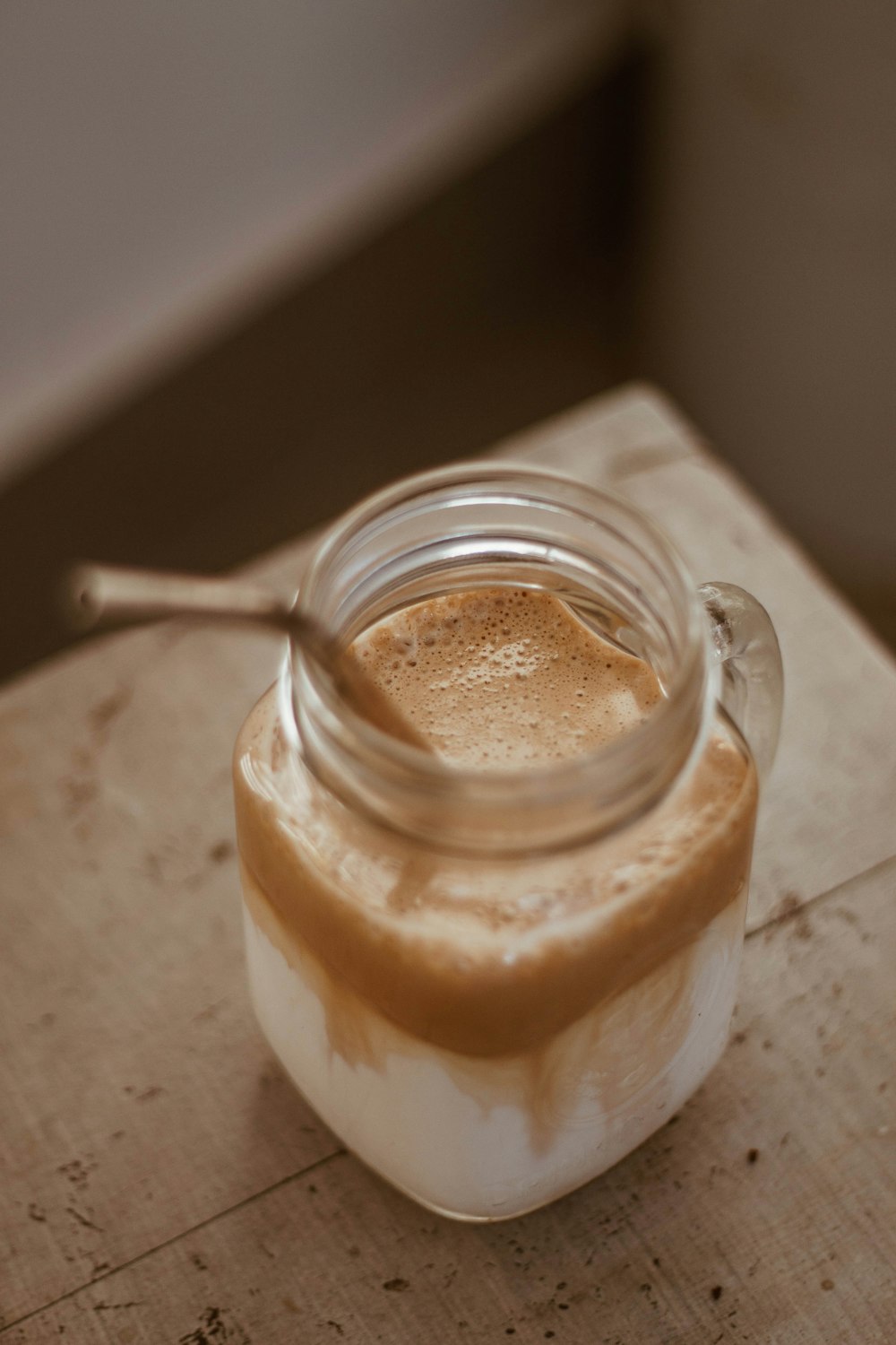 clear glass jar with brown liquid