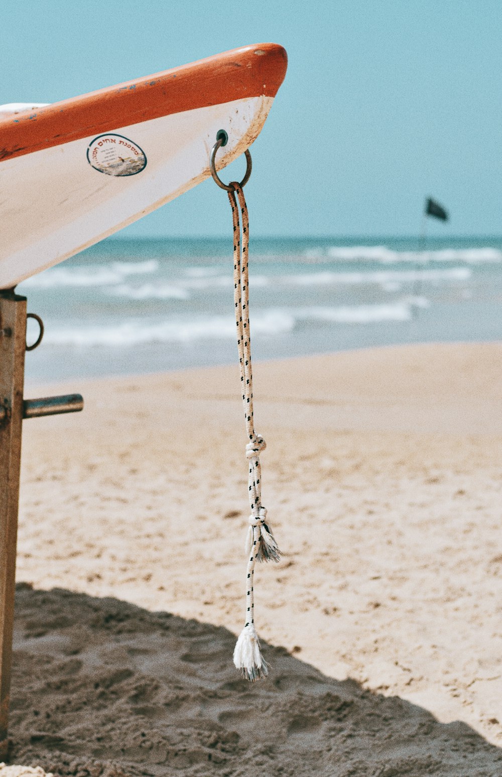 brown metal chain on beach during daytime