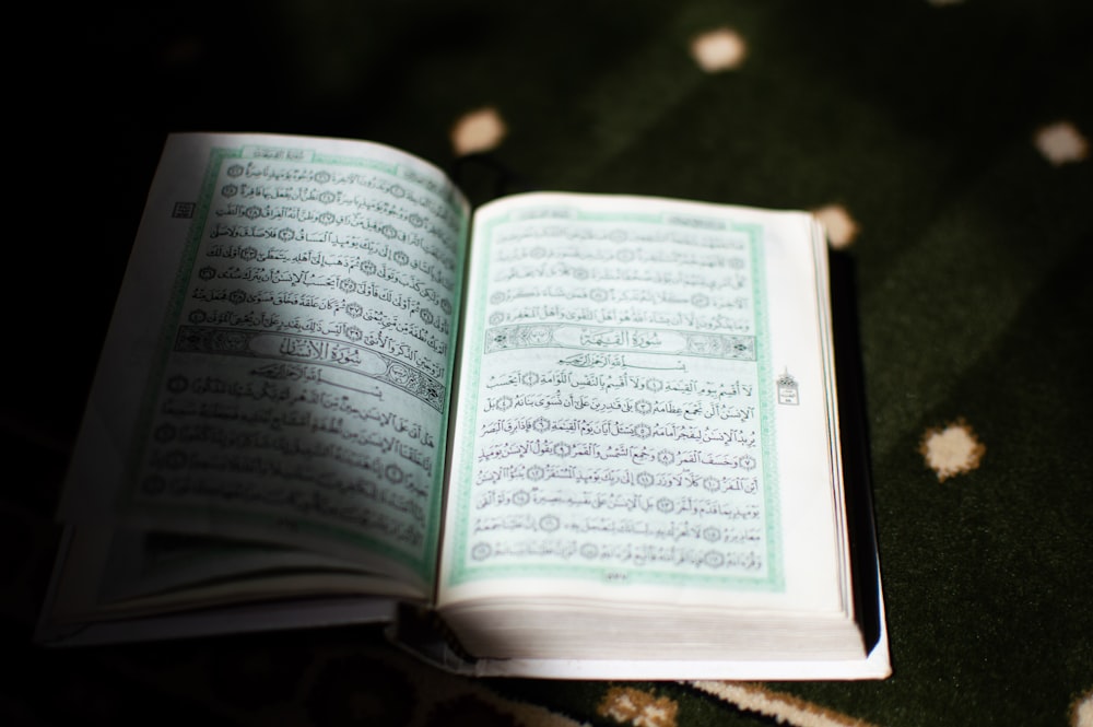 white book page on brown wooden table