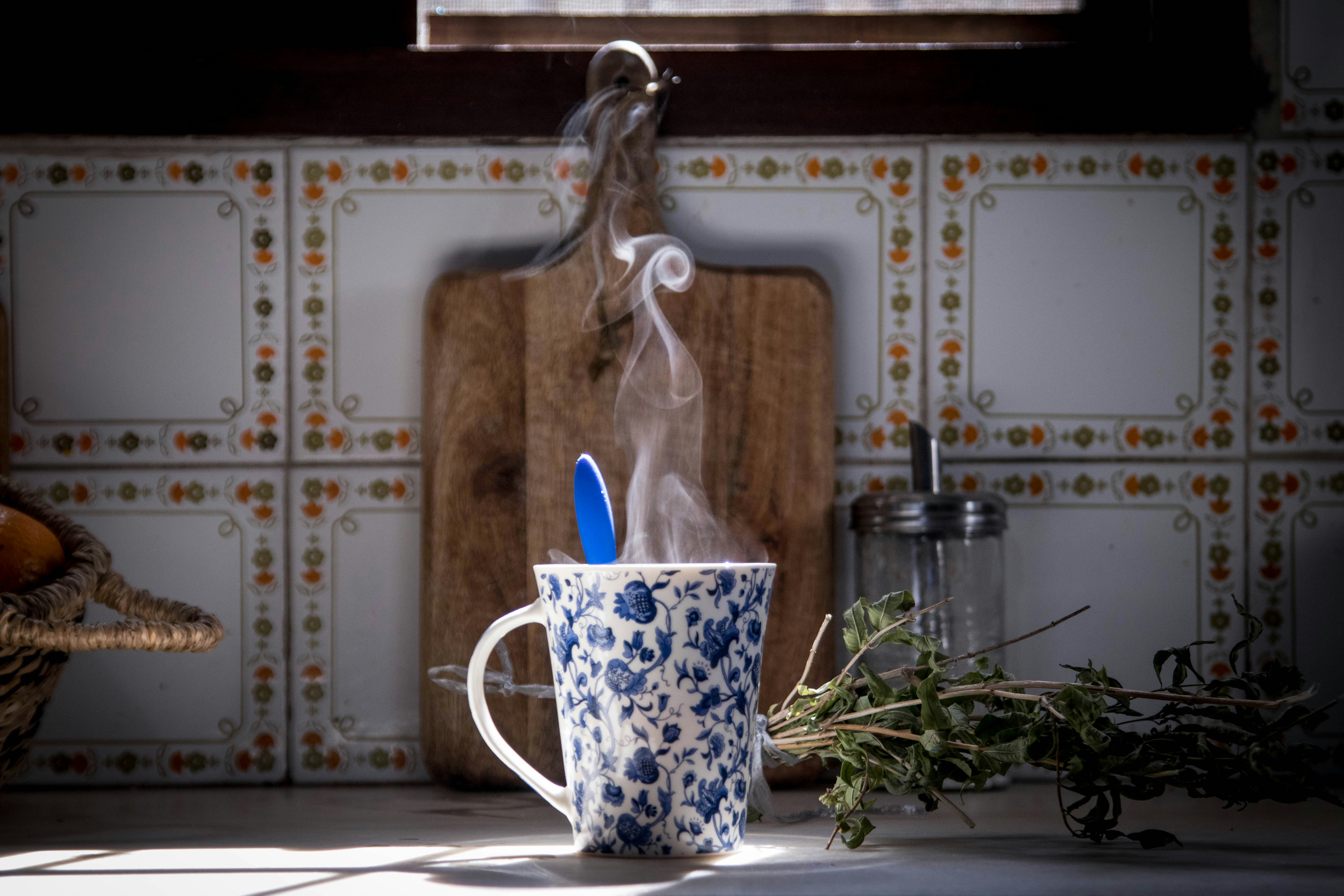 white and blue ceramic mug with white and blue rabbit print