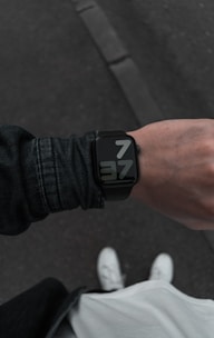 person wearing black smart watch